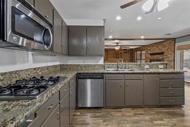 Gas cooktop, double ovens, and built-in microwave make it easy to prepare meals