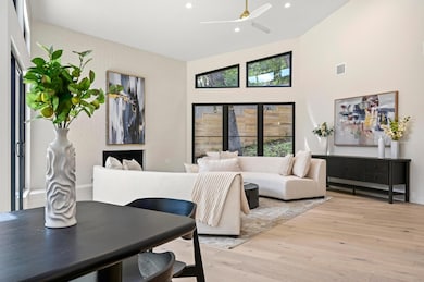 Living area with light wood finished floors, visi