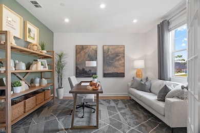This is a photo of one of our model homes. Please know that some of the exterior and interior finishes, paint, and features may vary.