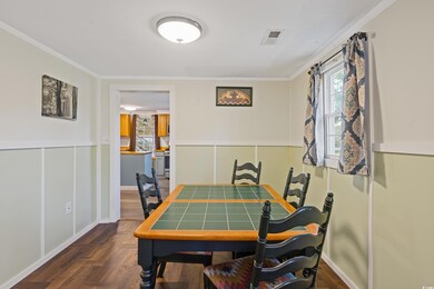 Dining area featuring ornamental molding