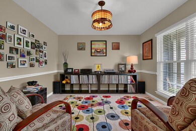Formal dining room with chair rail and Tiffany lig