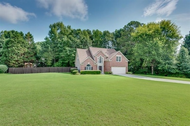 View of the massive flat front and side yard
