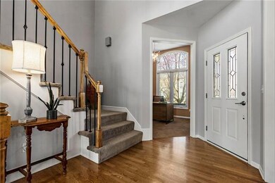 Bright and open 2 story entry way w/ office on mai
