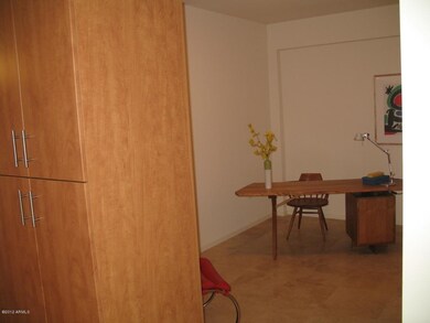 View of cabinets that separate den from