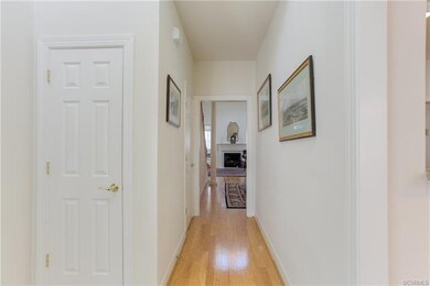 Entrance Hall w/ Coat Closet and view of LR w/ FP