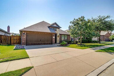 View of front of property with a garage and a fron