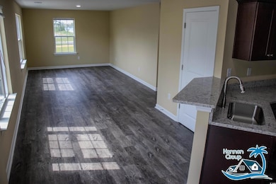 Interior space with dark hardwood / wood-style flo