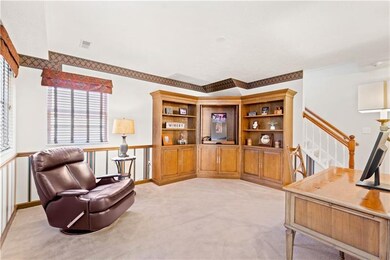 First floor den with wooden built-in cabinet and d