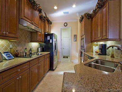 Kitchen Features Maple Cabinetry, Beautiful Quartz