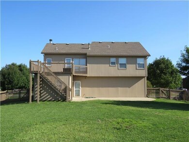 Fully fenced back yard will keep kids and pets con