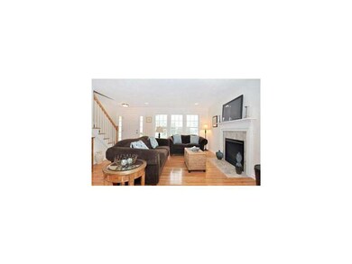 Living Room. Cozy up to the gas fireplace in this