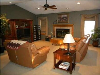 Formal living room with wood burning fireplace