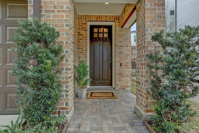 The brick entry welcomes you home.A ring doorbell