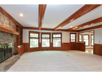 New carpet in family room, open to kitchen.