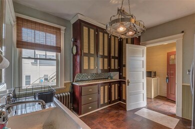 The kitchen has refinished cabinets and new counte