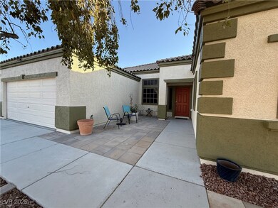 View of patio / terrace featuring an attached gara