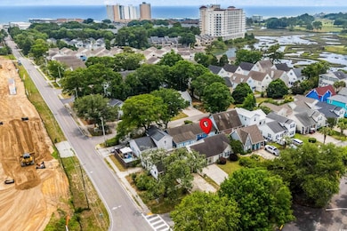 Aerial perspective of suburban area with a nearby body of water