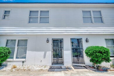 View of exterior entry with stucco siding