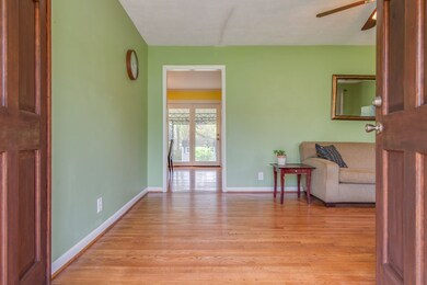 Come inside to the formal living room with rich hardwood floors.