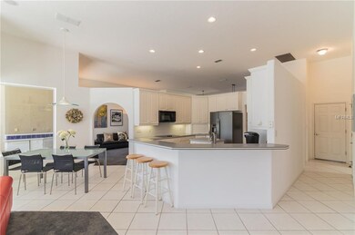 Open kitchen with breakfast bar & breakfast nook.