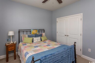 Bedroom featuring light carpet, a closet, and ceil