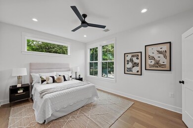 Bedroom featuring baseboards, wood finished floor