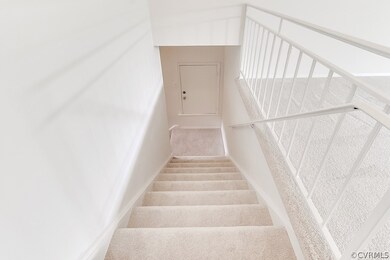 Stairway going down stairs....note the little 1/2 door....that is where you put your trash.  Then on the outside of the building is another door that the trash man can open and empty your trash.  Very handy!