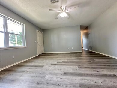 Unfurnished room featuring a textured ceiling, cei