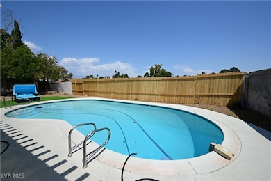 View of pool with a fenced backyard
