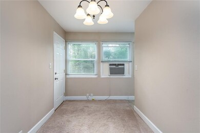 Dining room. This window unit does cool the entire
