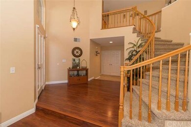 ENTRY WITH BEAUTIFUL LAMINATE WOOD FLOORING