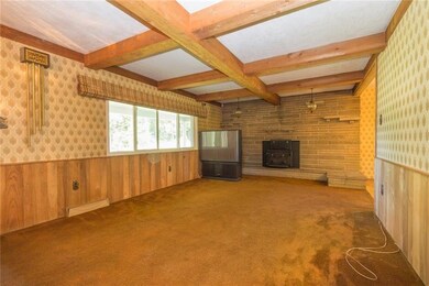 Large living room in this spacious house!  Stone f