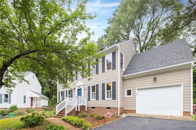 Paved driveway, attached garage