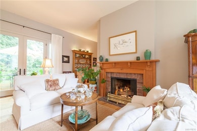 Living Room w/ gas fireplace & French doors that l