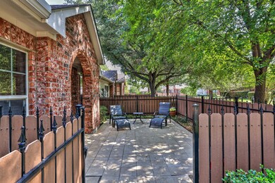 GATE THAT OPENS TO TILED COURTYARD AND PLENTY OF R