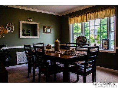 Formal dining with bay window