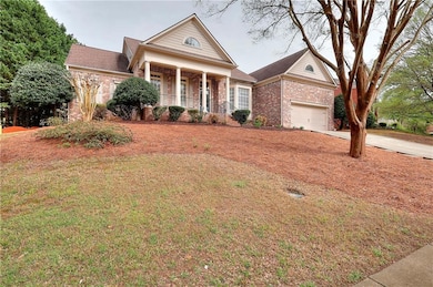 Greek revival inspired property featuring driveway