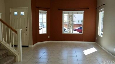 Living room next to formal dining room