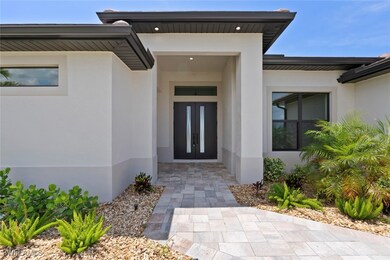 Entrance to property with french doors and stucco