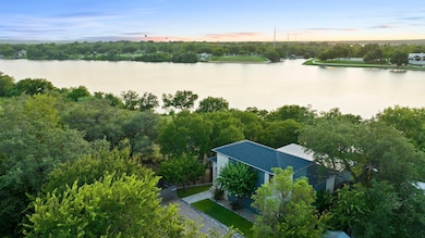 View of subject property with a large body of wat