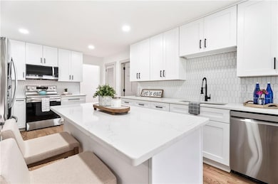 All new kitchen with quartz counters, stainless steel appliances and plenty of cabinets