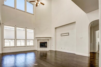 Unfurnished living room with baseboards, a firepla