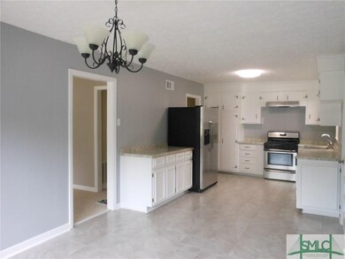 Entering from Living Room to Large Open Kitchen wi