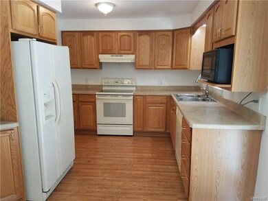 Bright kitchen with plenty of counters and cabinets.