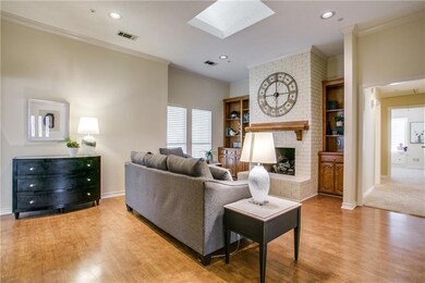 A great view of the beautiful fireplace and bookca