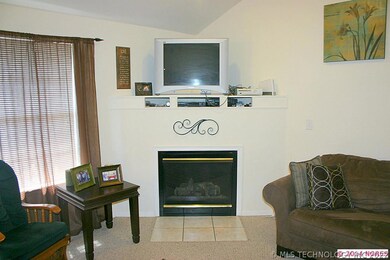 Gas log fireplace. Huge windows overlook backyard.