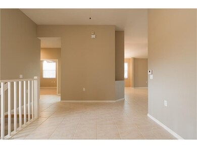 Open floor plan features formal dining room, famil
