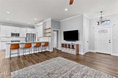 Living room with view of front door to right and e