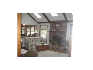 Family Room features lovely fireplace, skylights a