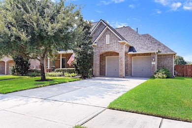 Front of the home with nice mature trees.